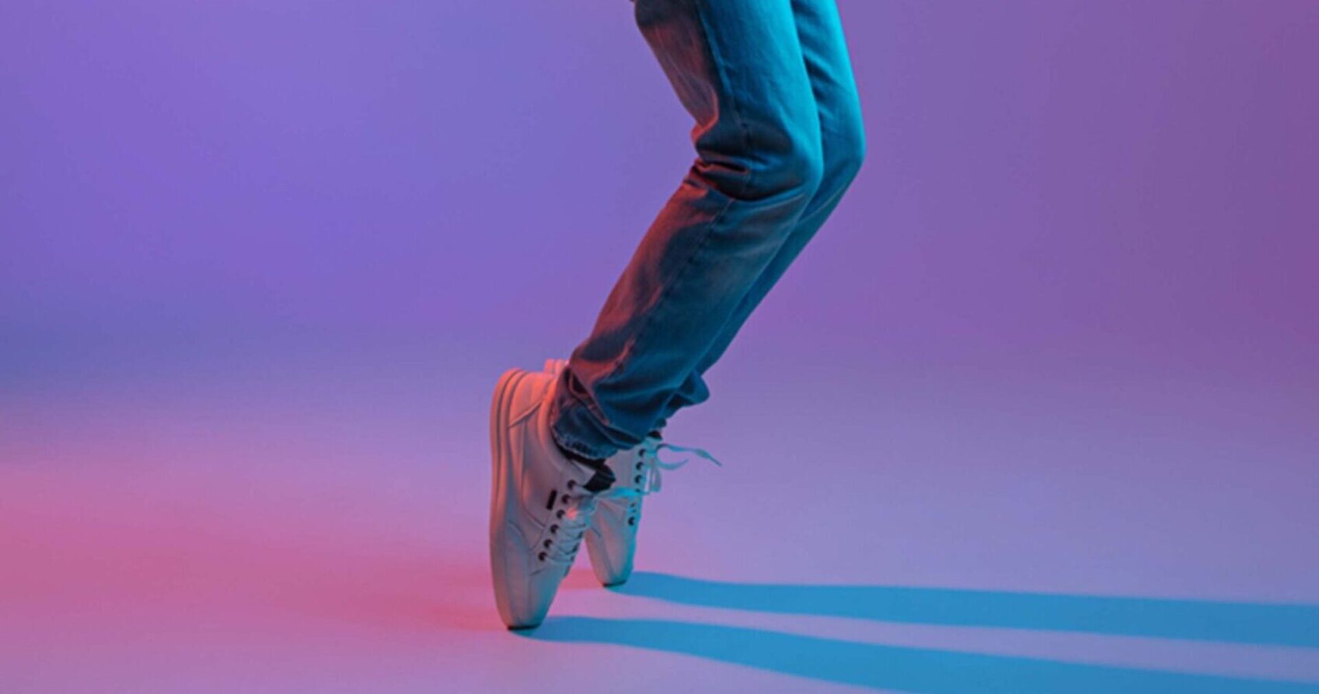 Happy man in casual clothes isolated over gradient background in neon light Happy man in casual clothes isolated over gradient background in neon light